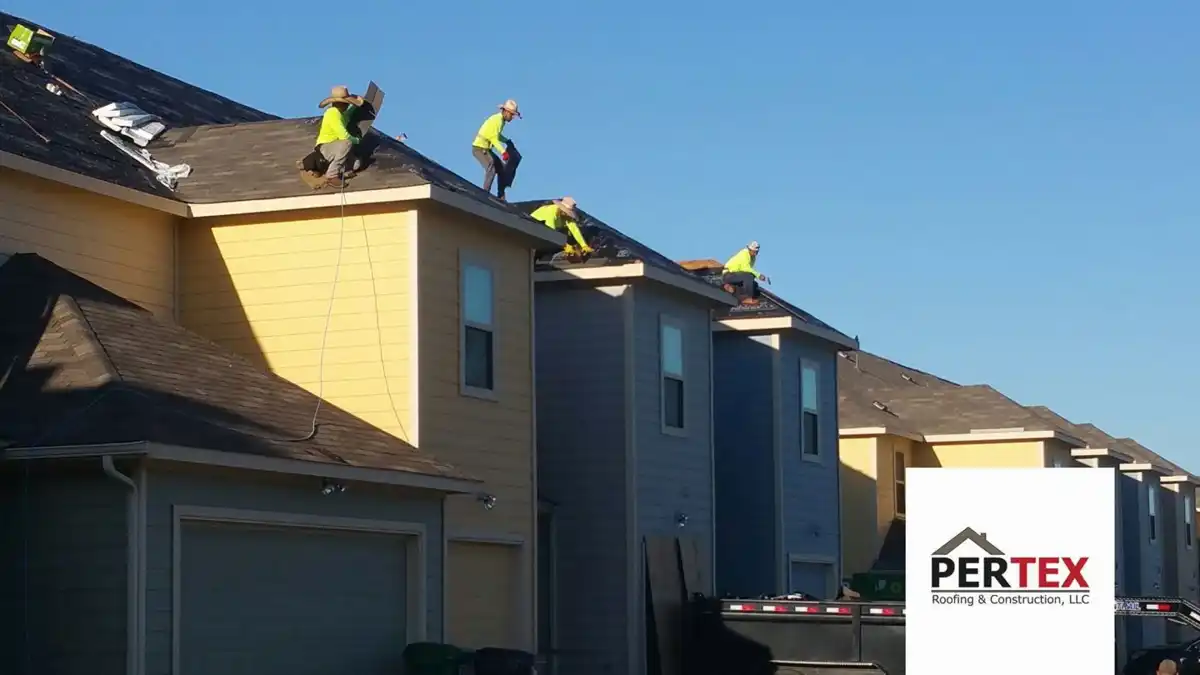 PERTEX crew nailing shingles on steep residential roof