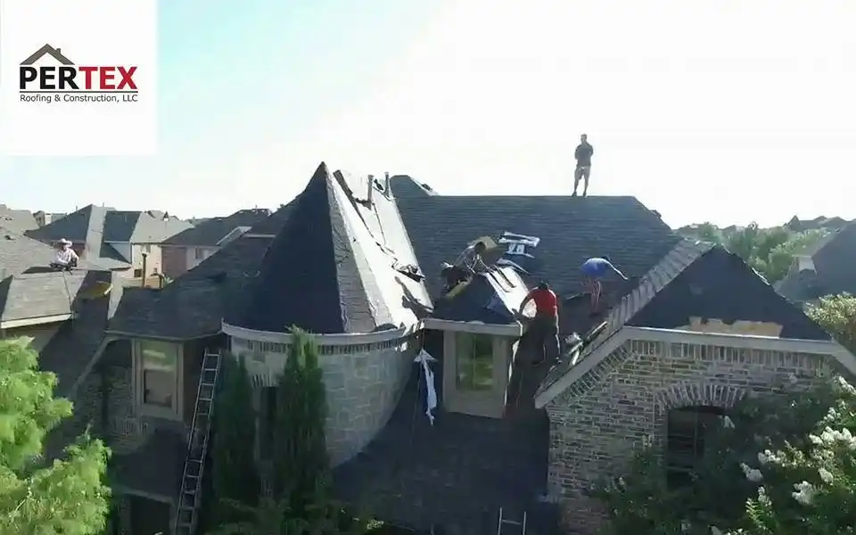 PERTEX crew installing roof on brick home with turret